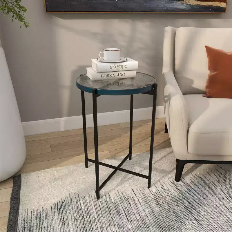 Guéridon en métal en forme de X avec plateau en verre texturé noir